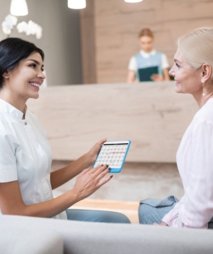 team member speaking with patient about dental insurance